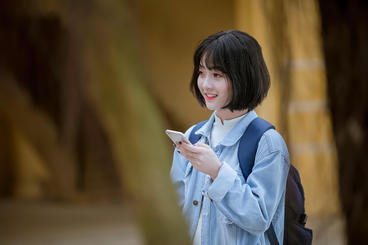 woman, smile, smartphone, portrait, black hair, shirt, happy, girl, young, outdoors